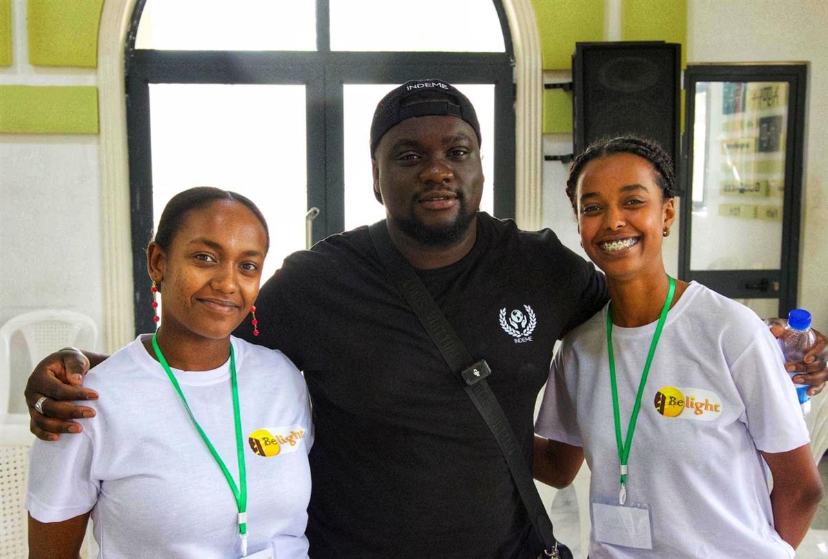 BeLight staff in branded t-shirts with volunteers